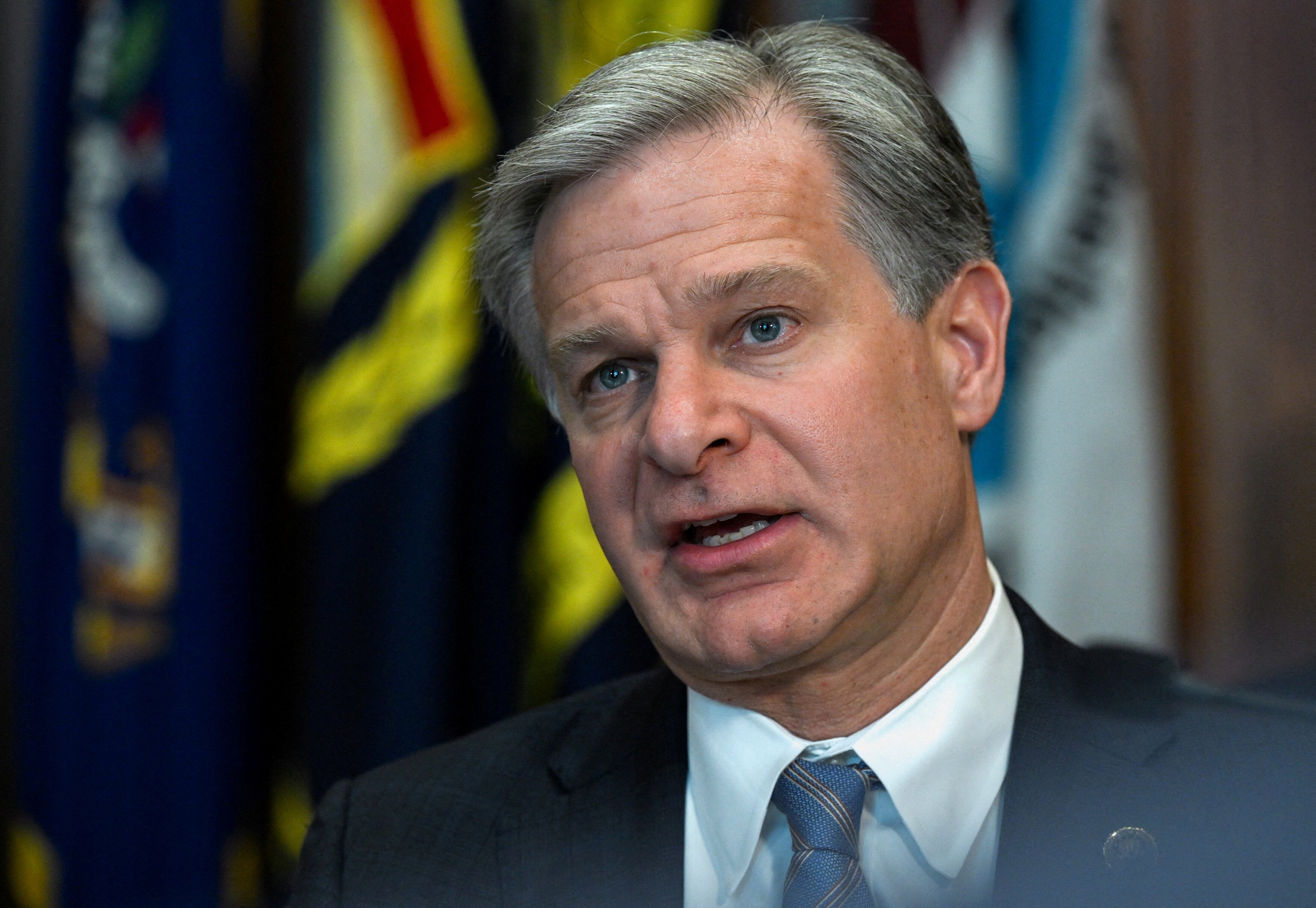 FILE PHOTO: FBI Director Christopher Wray speaks during a meeting of the Department of Justice. REUTERS/Annabelle Gordon/File Photo