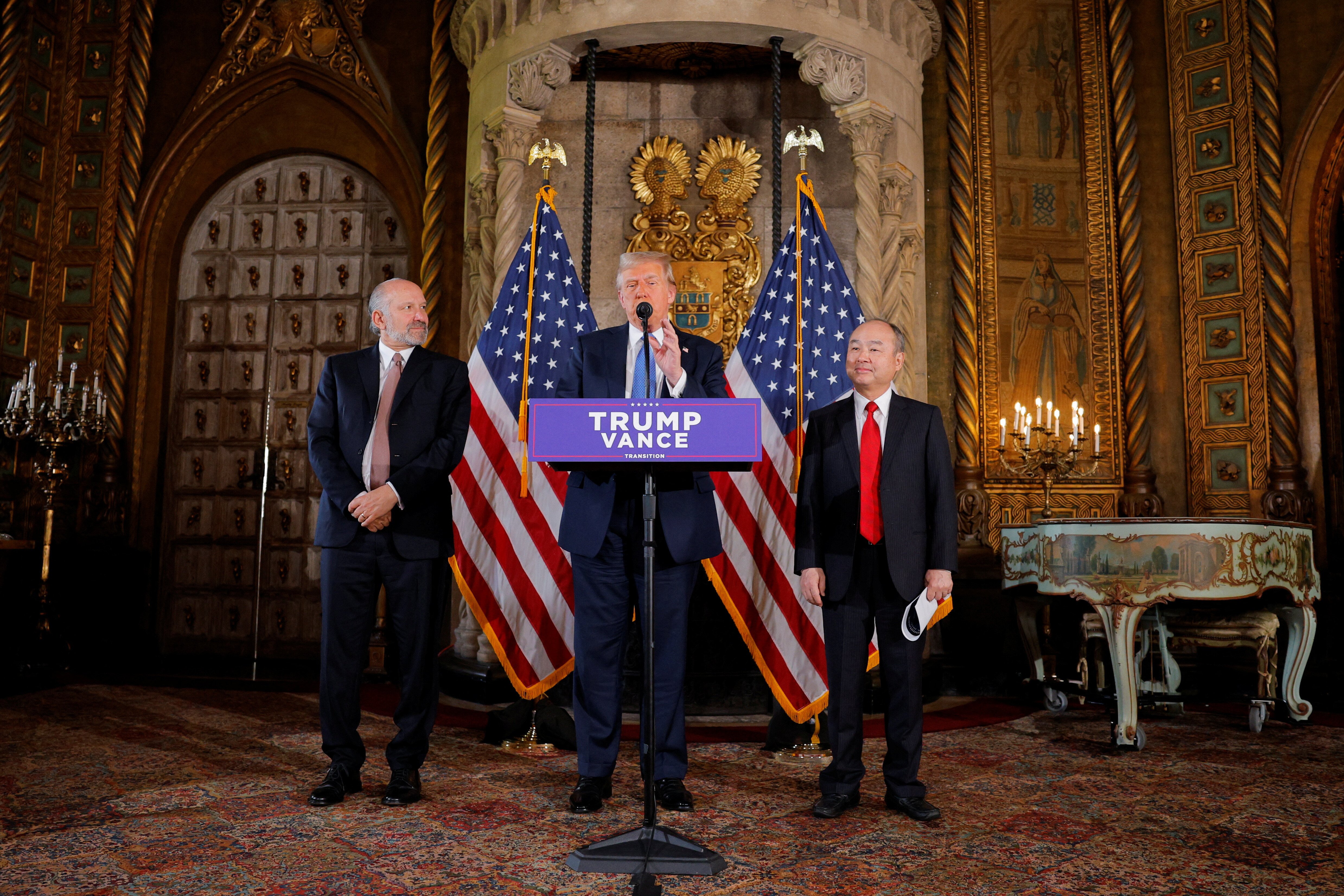 U.S. President-elect Donald Trump delivers remarks next to Chairman and CEO of SoftBank, Masayoshi Son, at Mar-a-Lago in Palm Beach, Florida, U.S., December 16, 2024. REUTERS/Brian Snyder