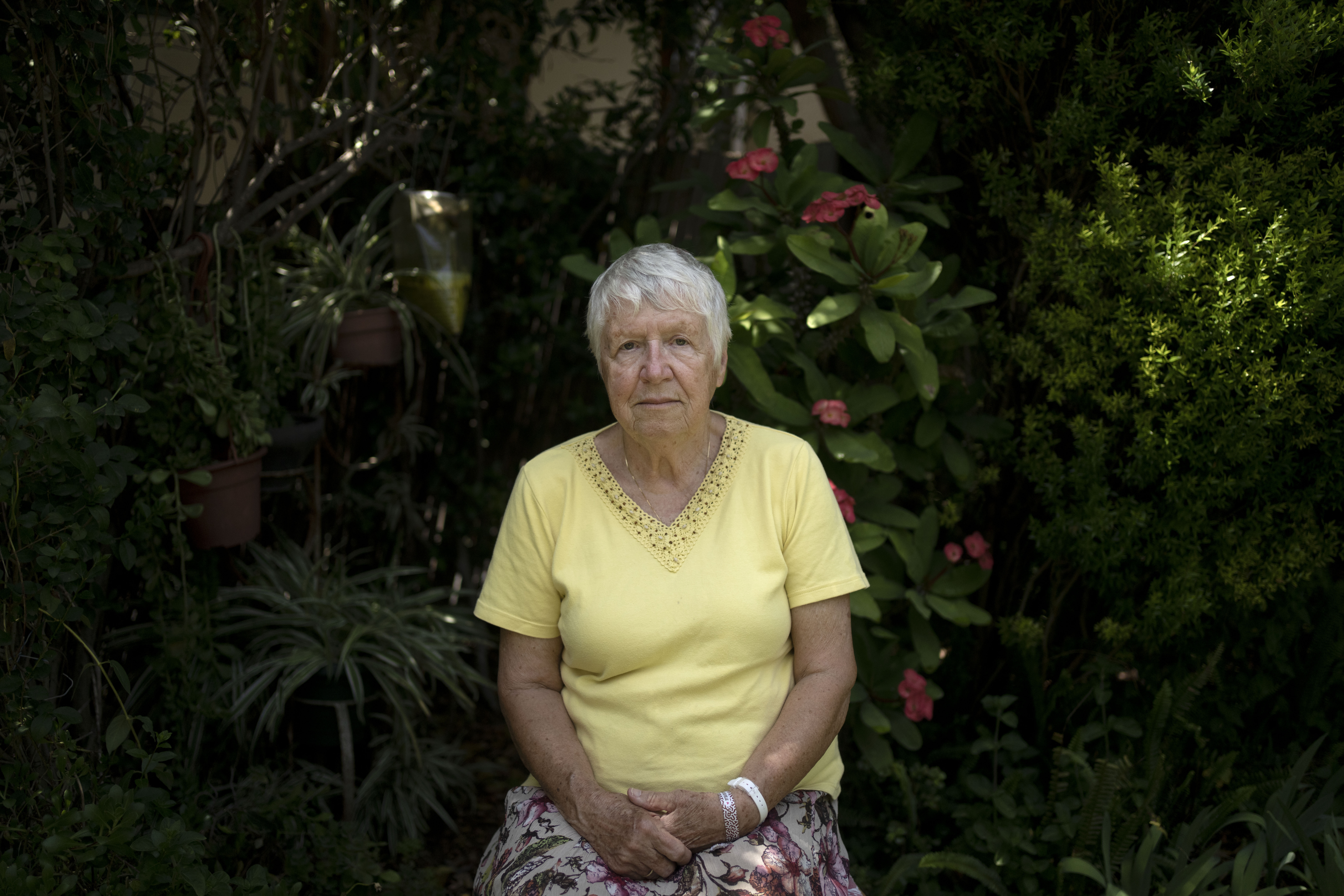 Judith Tzamir, a Holocaust survivor from Germany, poses for a portrait in her family home in Kibbutz Meflasim, southern Israel, Friday, May 3, 2024. On Monday, Tzamir will join 55 other Holocaust survivors from Israel and around the world for a memorial march in Poland, called March of the Living. (AP Photo/Maya Alleruzzo)