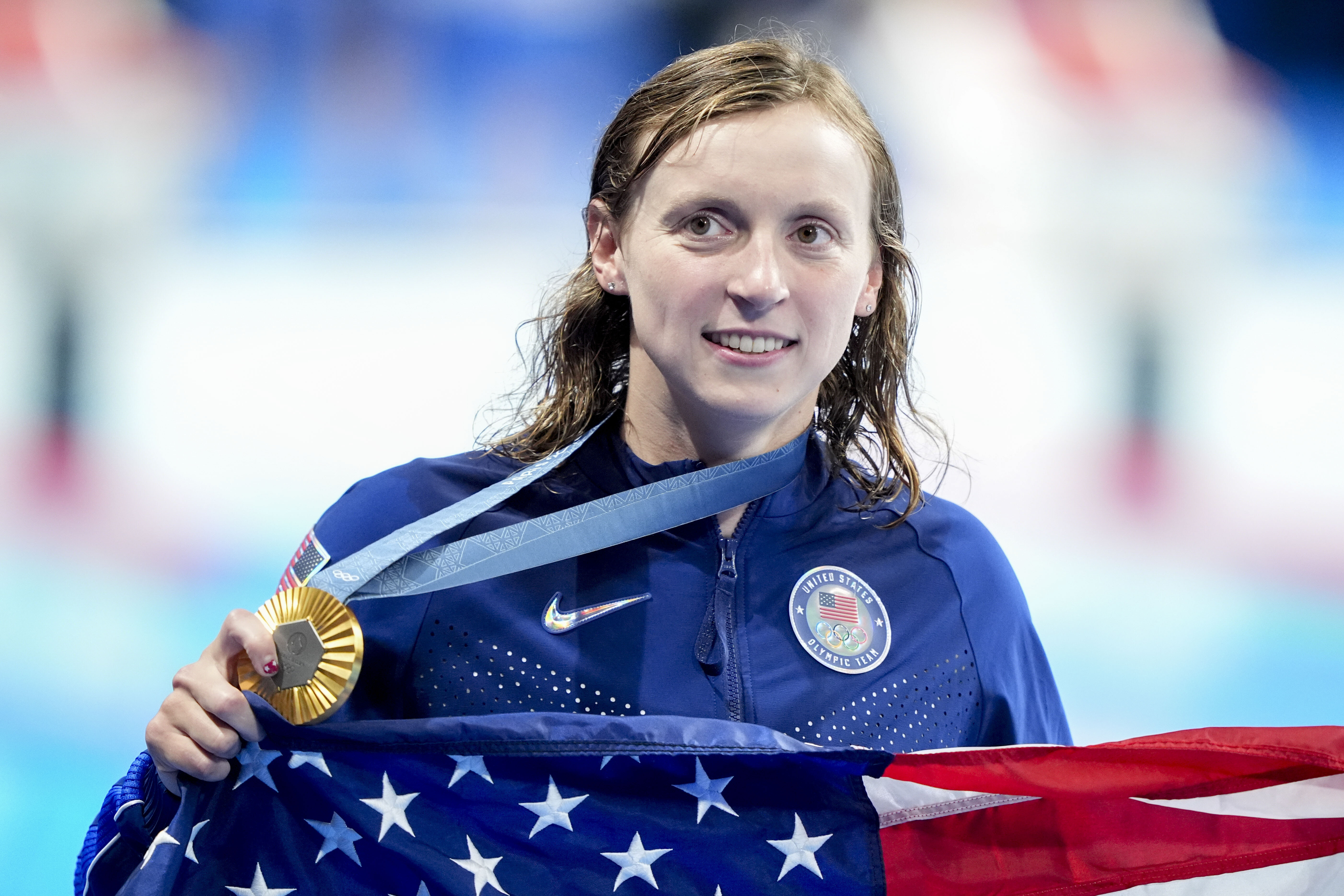 Jul 31, 2024; Nanterre, France; Katie Ledecky (USA) in the women’s 1,500-meter freestyle medal ceremony during the Paris 2024 Olympic Summer Games at Paris La Défense Arena. credit: Grace Hollars-USA TODAY Sports