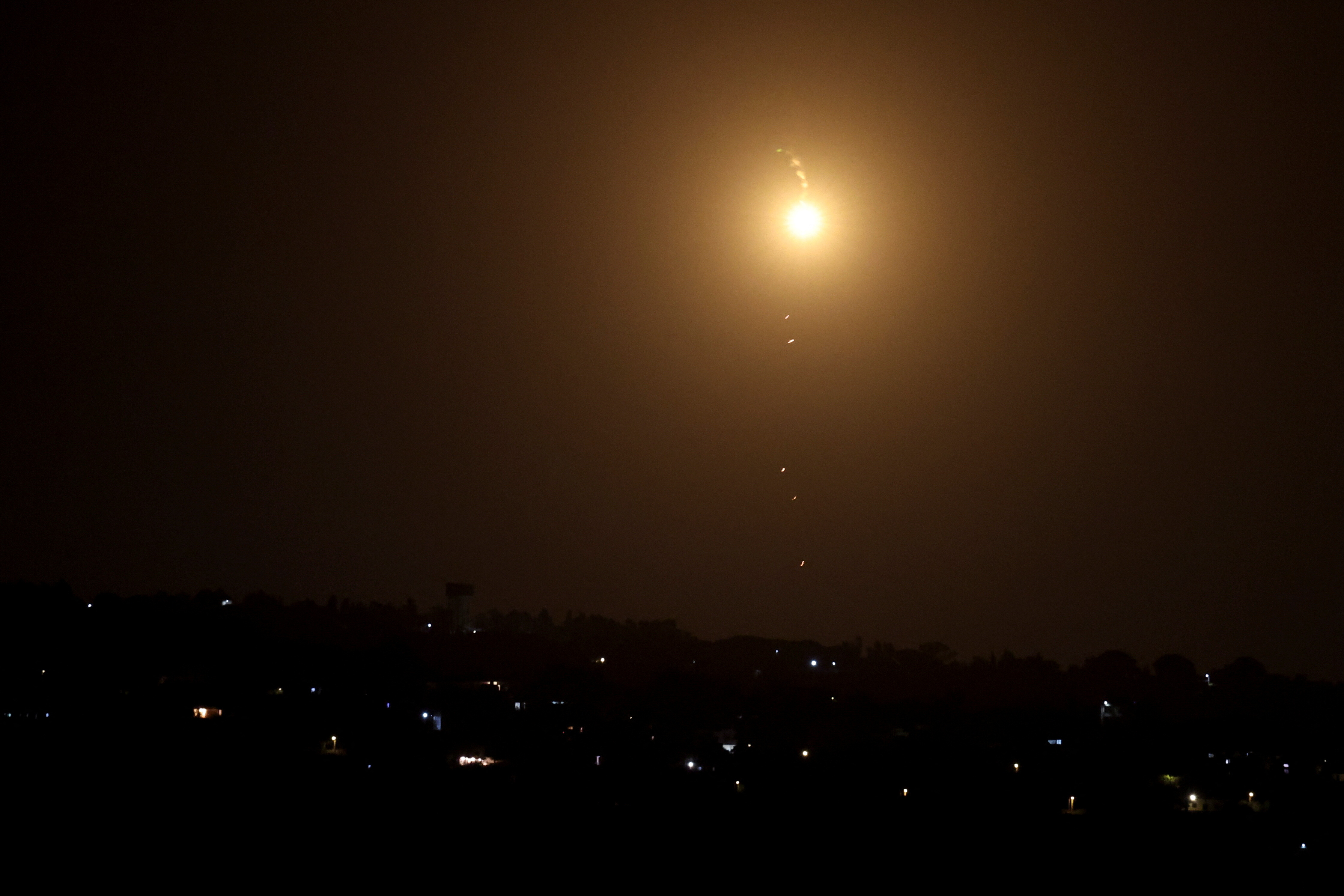 A flare burns in the sky after Iran fired a salvo of ballistic missiles at Israel amid ongoing hostilities between Hezbollah and Israeli forces, as seen from Tyre, southern Lebanon October 1, 2024. REUTERS/Aziz Taher