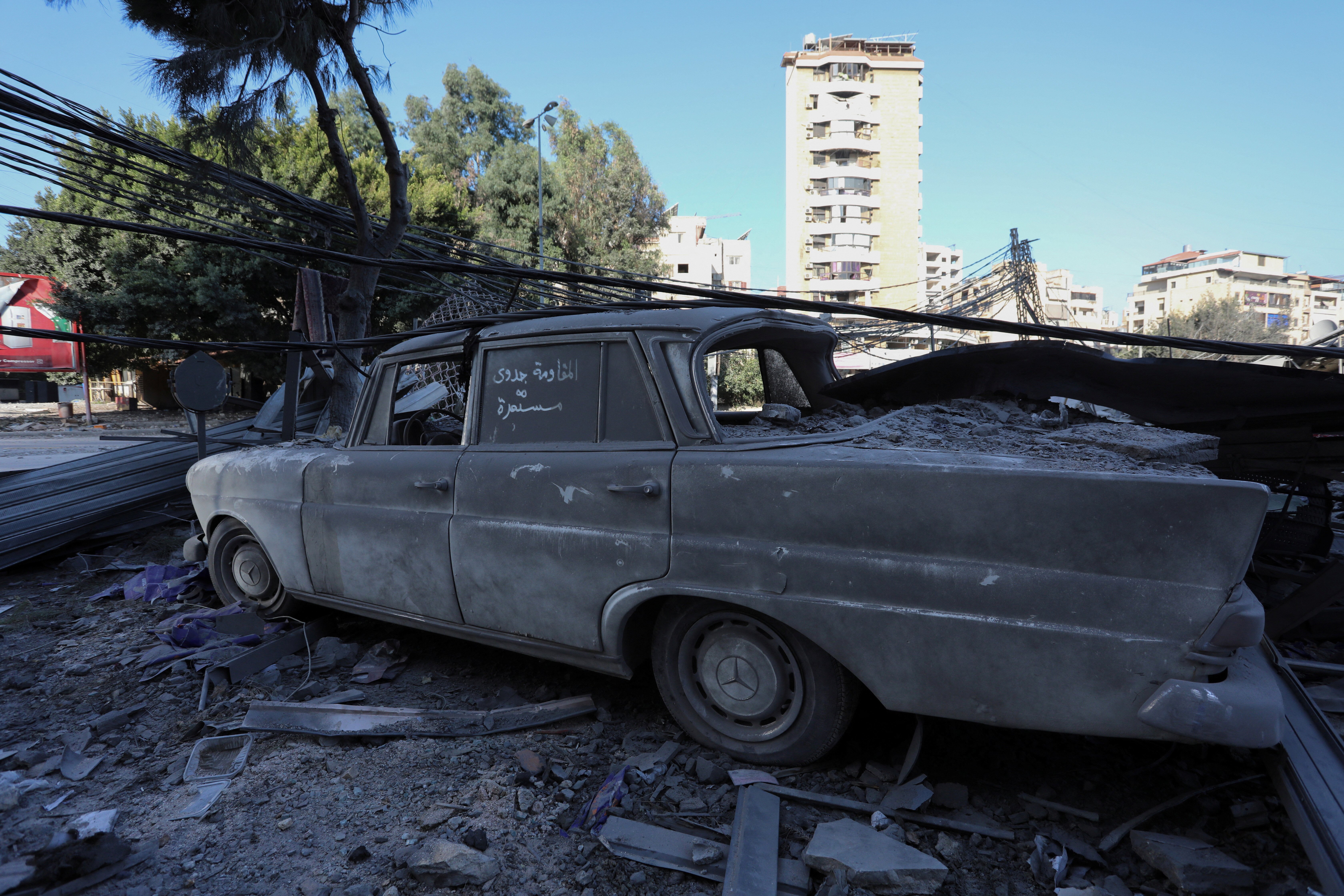 A view shows a damaged vehicle, in the aftermath of Israeli strikes on Beirut's southern suburbs, amid the ongoing hostilities between Hezbollah and Israeli forces, in Lebanon, October 8, 2024. REUTERS/Mohammed Yassin