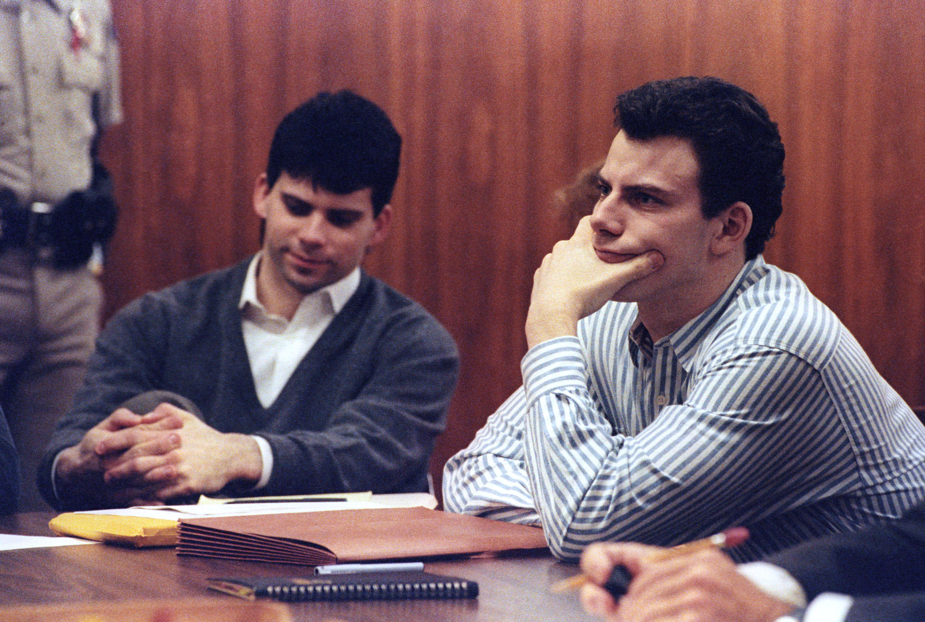 Erik Menendez (R) and brother Lyle listen to court proceedings during a May 17, 1991 appearance in the case of the shotgun murder of their wealthy parents in August 1989. The California Supreme Court must decide whether to review a lower court decision to allow alleged tape confessions made to a psychiatrist as evidence before a preliminary hearing can take place. REUTERS/Lee Celano