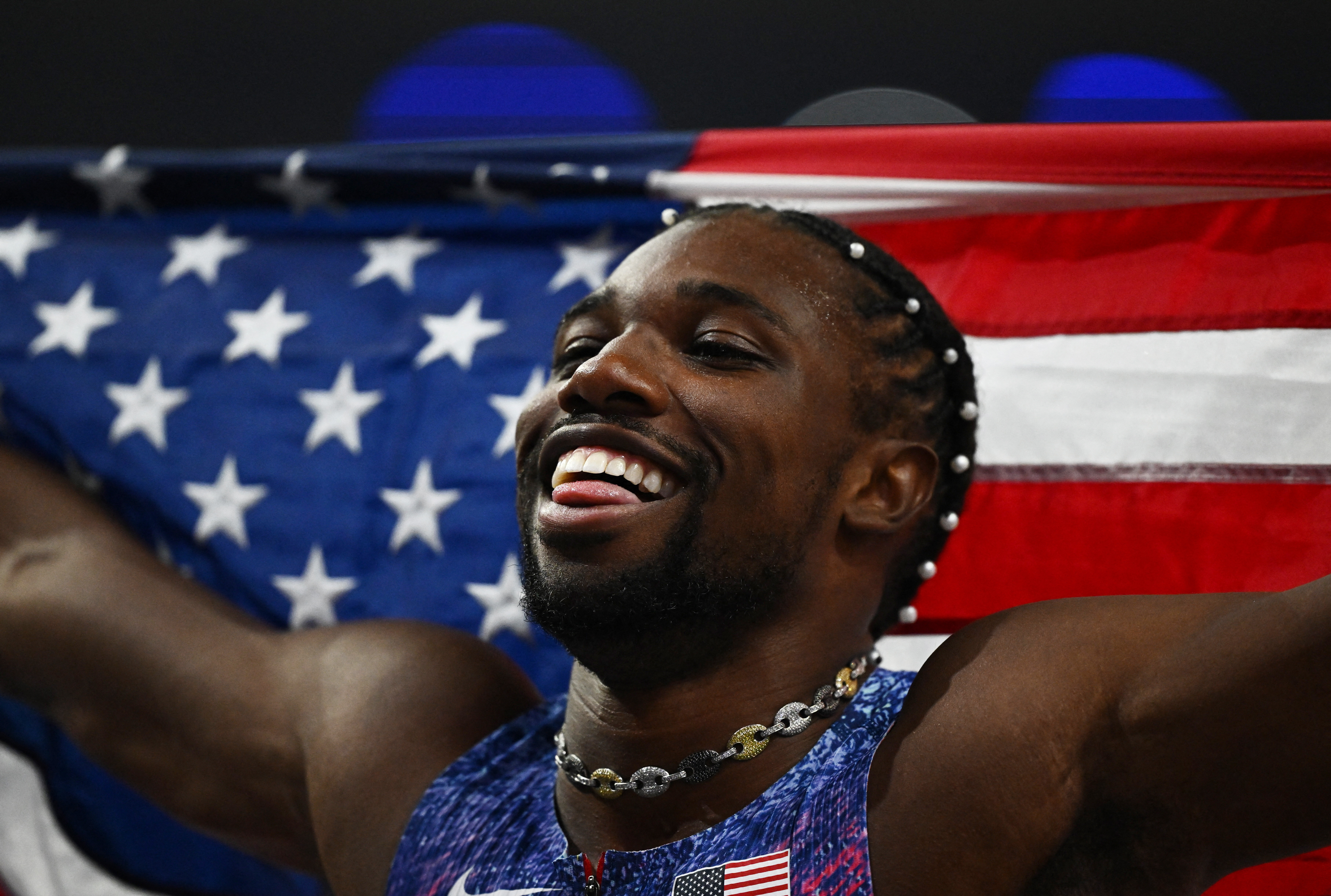 Paris 2024 Olympics - Athletics - Men's 100m Final - Stade de France, Saint-Denis, France - August 04, 2024. Noah Lyles of United States celebrates after winning gold. REUTERS/Dylan Martinez