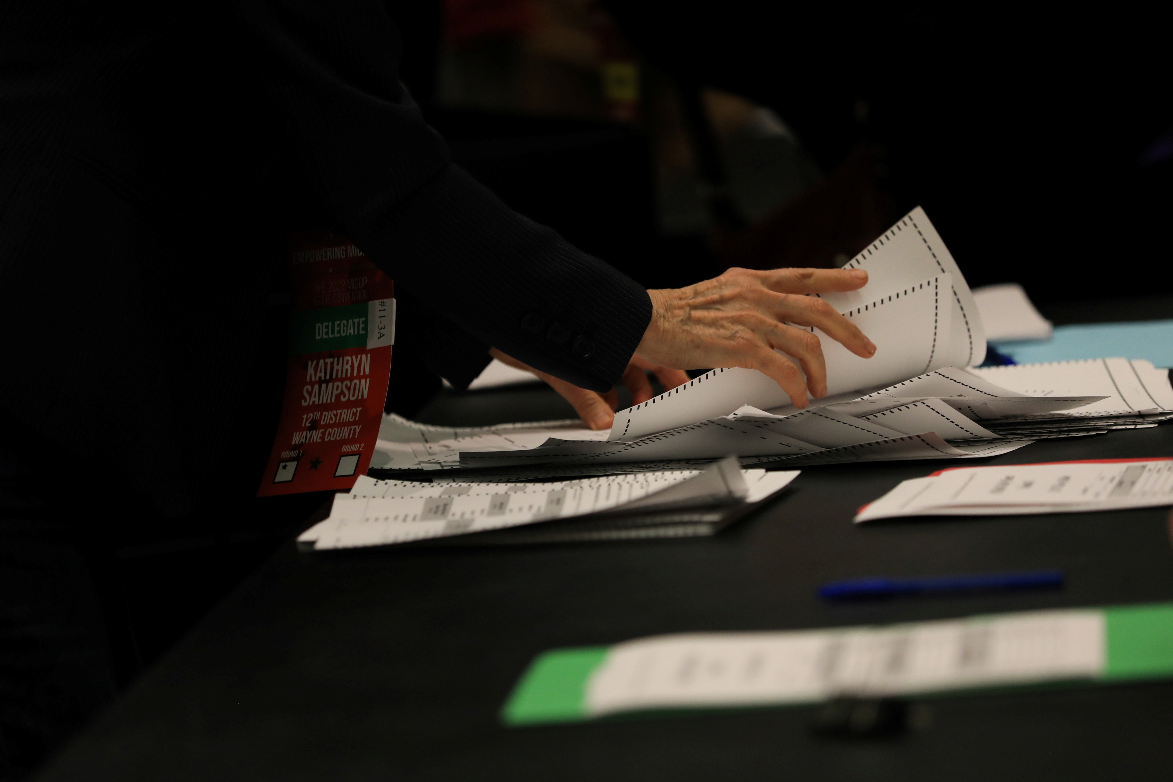 Republicans hand-count ballots for GOP delegates during the 