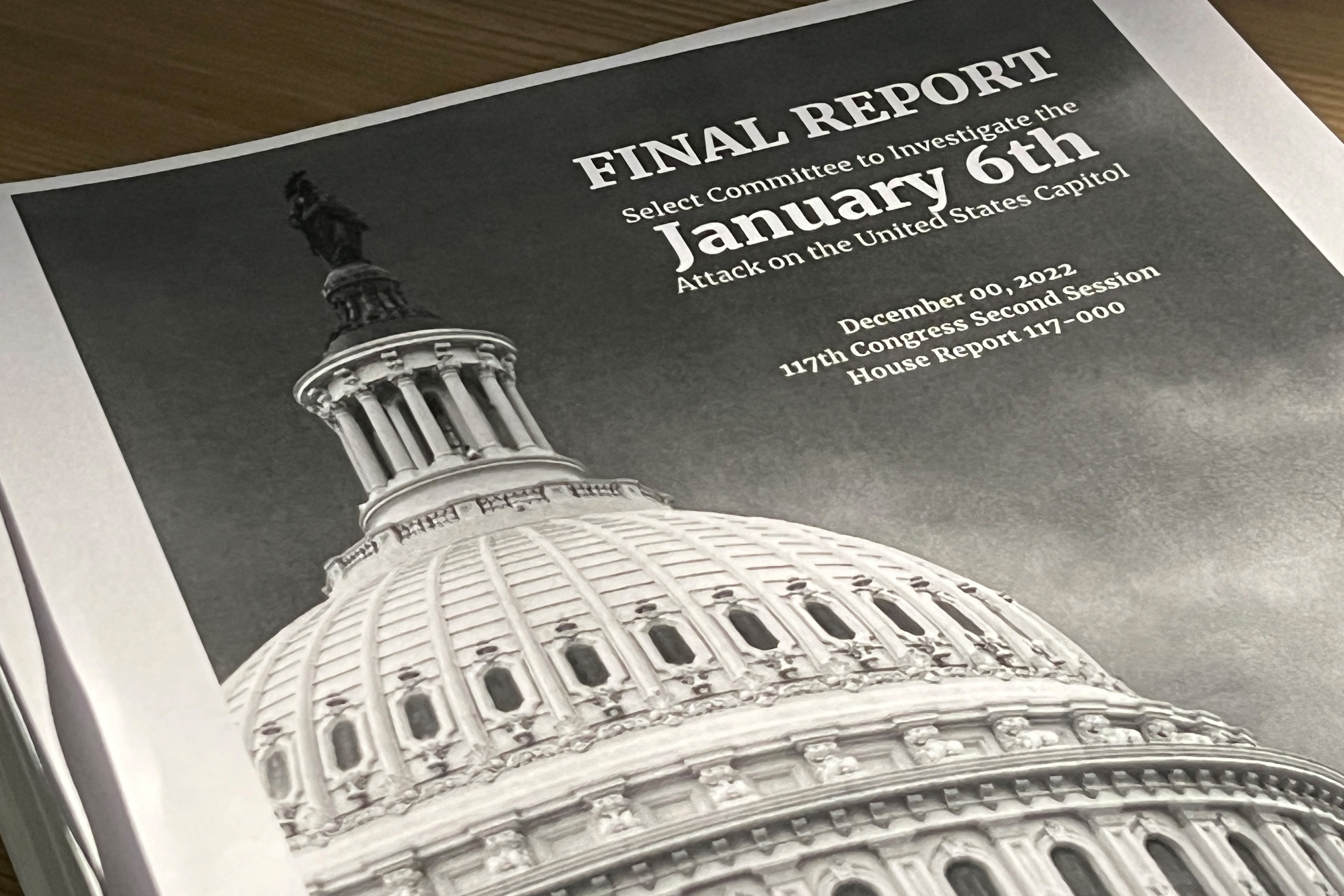 A copy of the printed final report by the congressional panel probing the Jan. 6, 2021 attack on the U.S. Capitol, outlining its case that former U.S. President Donald Trump should face criminal charges of inciting the deadly riot, is seen in a photo illustration in Washington, U.S. December 23, 2022. REUTERS/Julio-Cesar Chavez