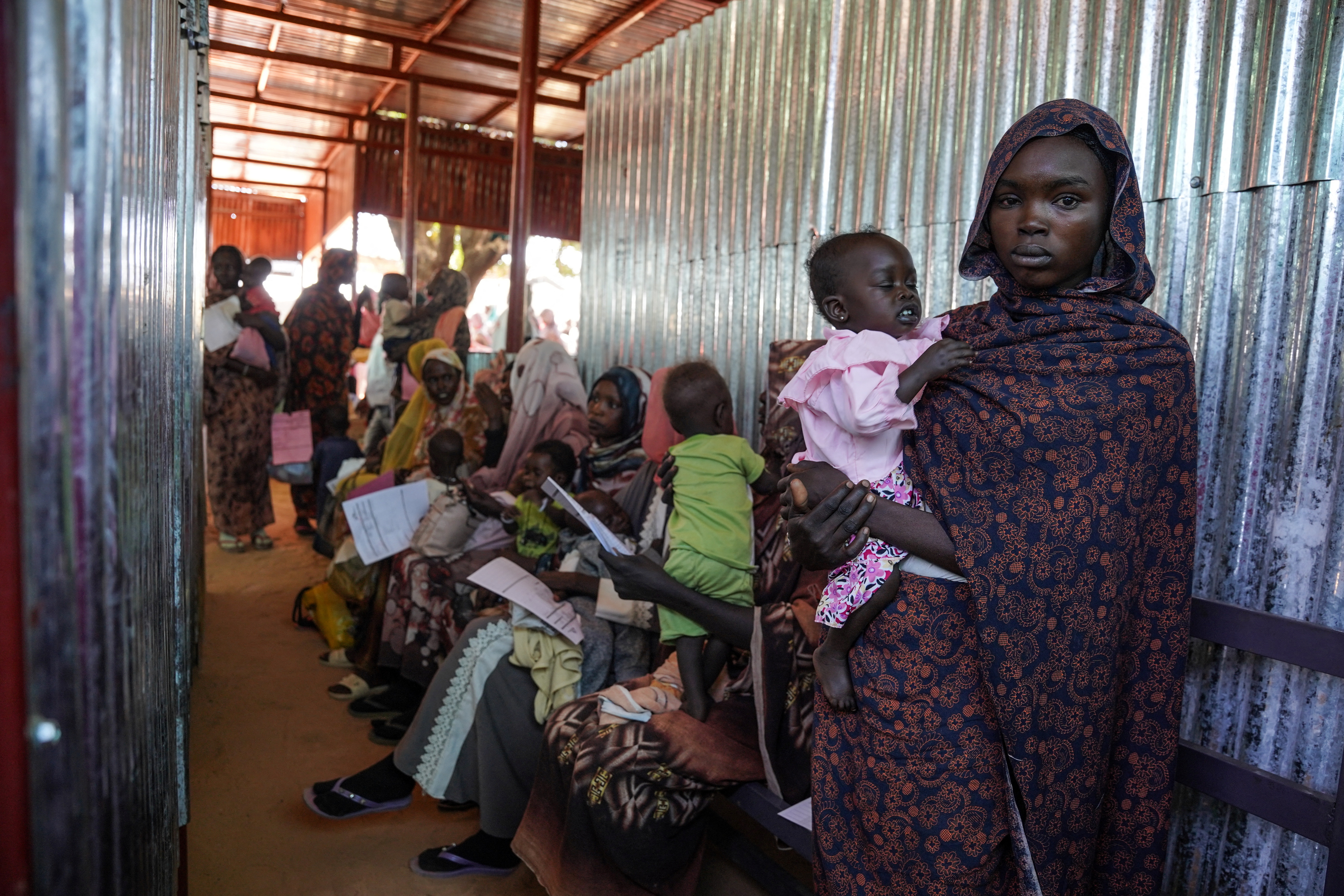 A handout photograph, shot in January 2024, shows a woman and baby at the Zamzam displacement camp, close to El Fasher in North Darfur, Sudan. An assessment by Medecins Sans Frontieres (Doctors Without Borders) in January found that at the camp, which is home to an estimated 400,000 people, two babies were dying every hour. Nearly 40% of children aged six months to two years old were malnourished, the group found. MSF/Mohamed Zakaria/Handout via REUTERS