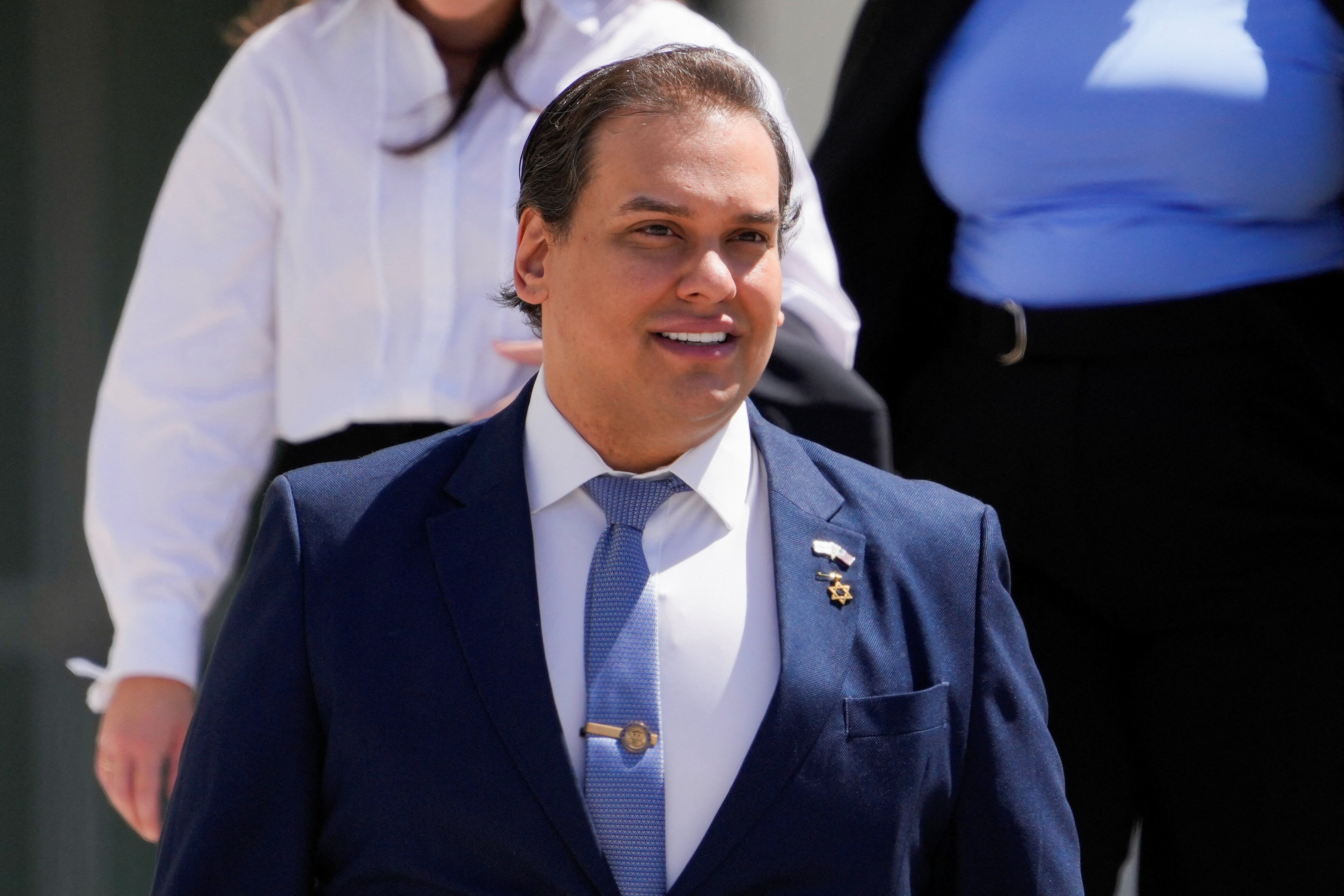 George Santos, who was expelled from the U.S. House of Representatives, leaves court in Long Island after his corruption trial in Central Islip, New York, U.S. August 13, 2024. REUTERS/Adam Gray