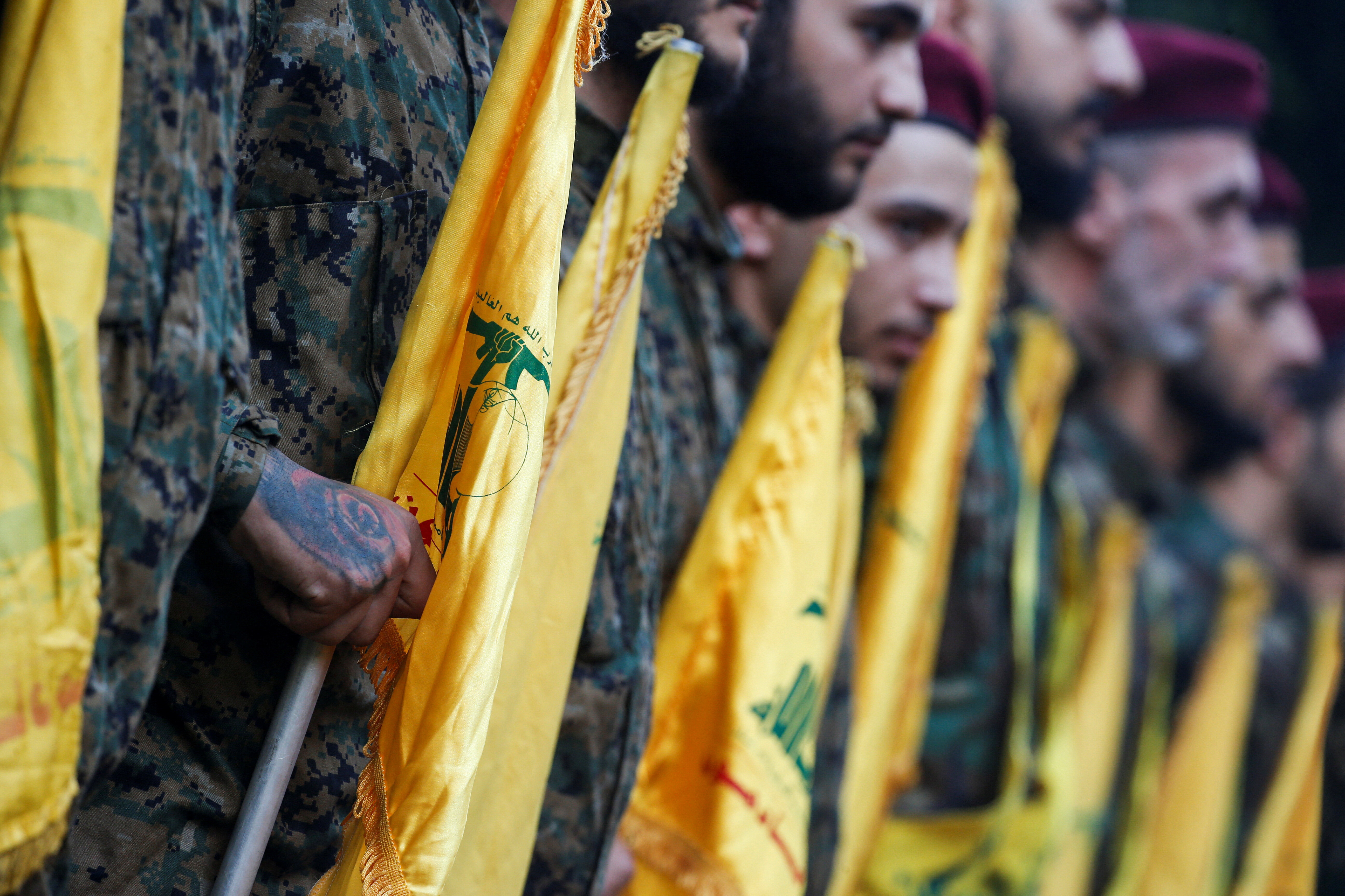 Hezbollah members line up at the funeral of Hezbollah senior leader Ibrahim Aqil and Hezbollah member Mahmoud Hamad, who were killed in Friday's Israeli strike on Beirut's southern suburbs, in Beirut, Lebanon, September 22, 2024. REUTERS/Amr Abdallah Dalsh