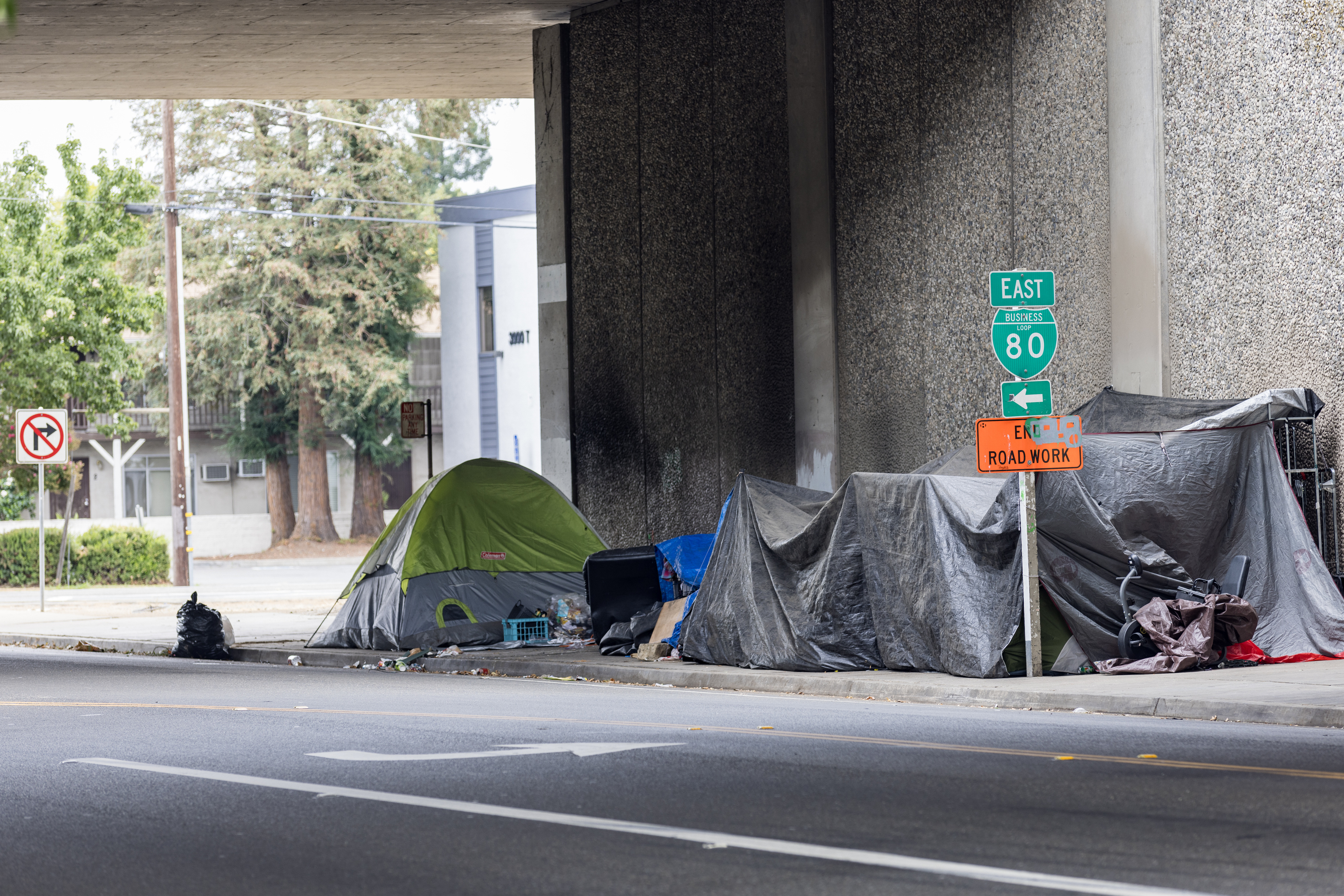 Sacramento, Sept 2, 2023: Homeless Tents on sidewalk along T Street under Business 80. Shows the challenges that Homeless Tents on public space is causing for Sacramento.