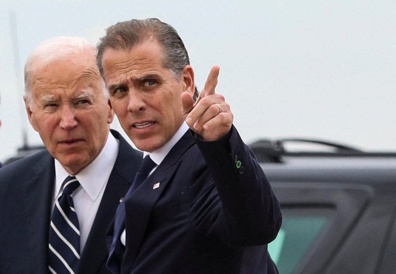 U.S. President Joe Biden stands with his son Hunter Biden, who earlier in the day was found guilty on all three counts in his criminal gun charges trial, after President Biden arrived at the Delaware Air National Guard Base in New Castle, Delaware, U.S., June 11, 2024. REUTERS/Anna Rose Layden