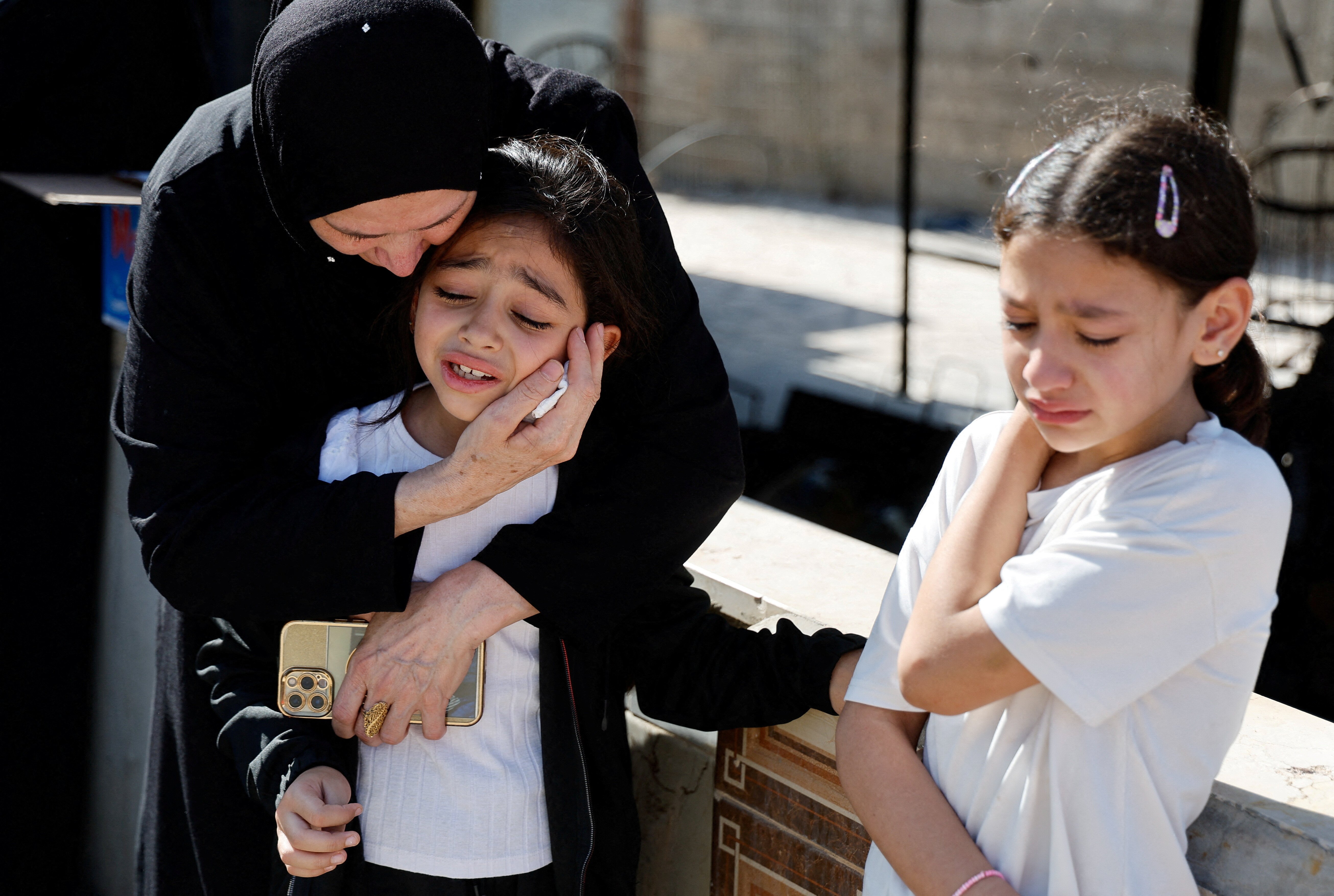 Mourners react during the funeral of Palestinians who were killed in an airstrike during an Israeli raid, in Tubas in the Israeli-occupied West Bank, September 13, 2024. REUTERS/Raneen Sawafta 