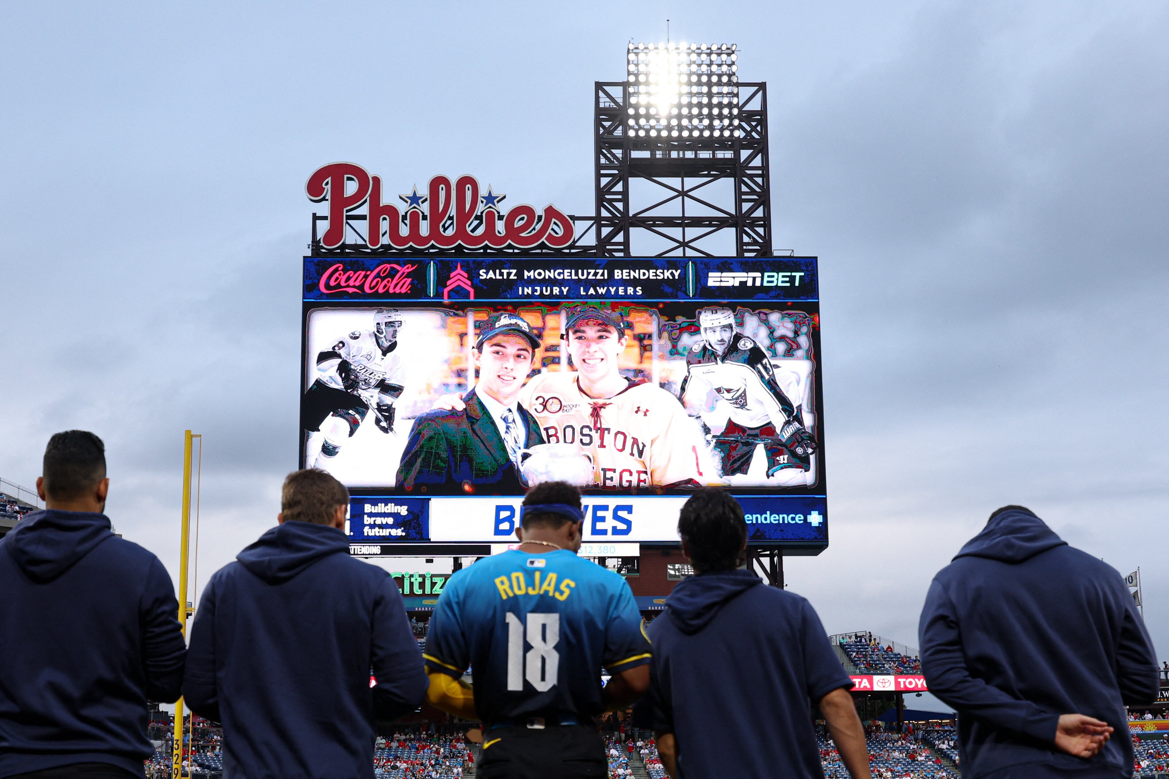 Aug 30, 2024; Philadelphia, Pennsylvania, USA; Players and fans stand for a moment of silence for NHL player Johnny Gaudreau who passed away the night before the game between the Philadelphia Phillies and the Atlanta Braves at Citizens Bank Park. Mandatory Credit: Bill Streicher-USA TODAY Sports