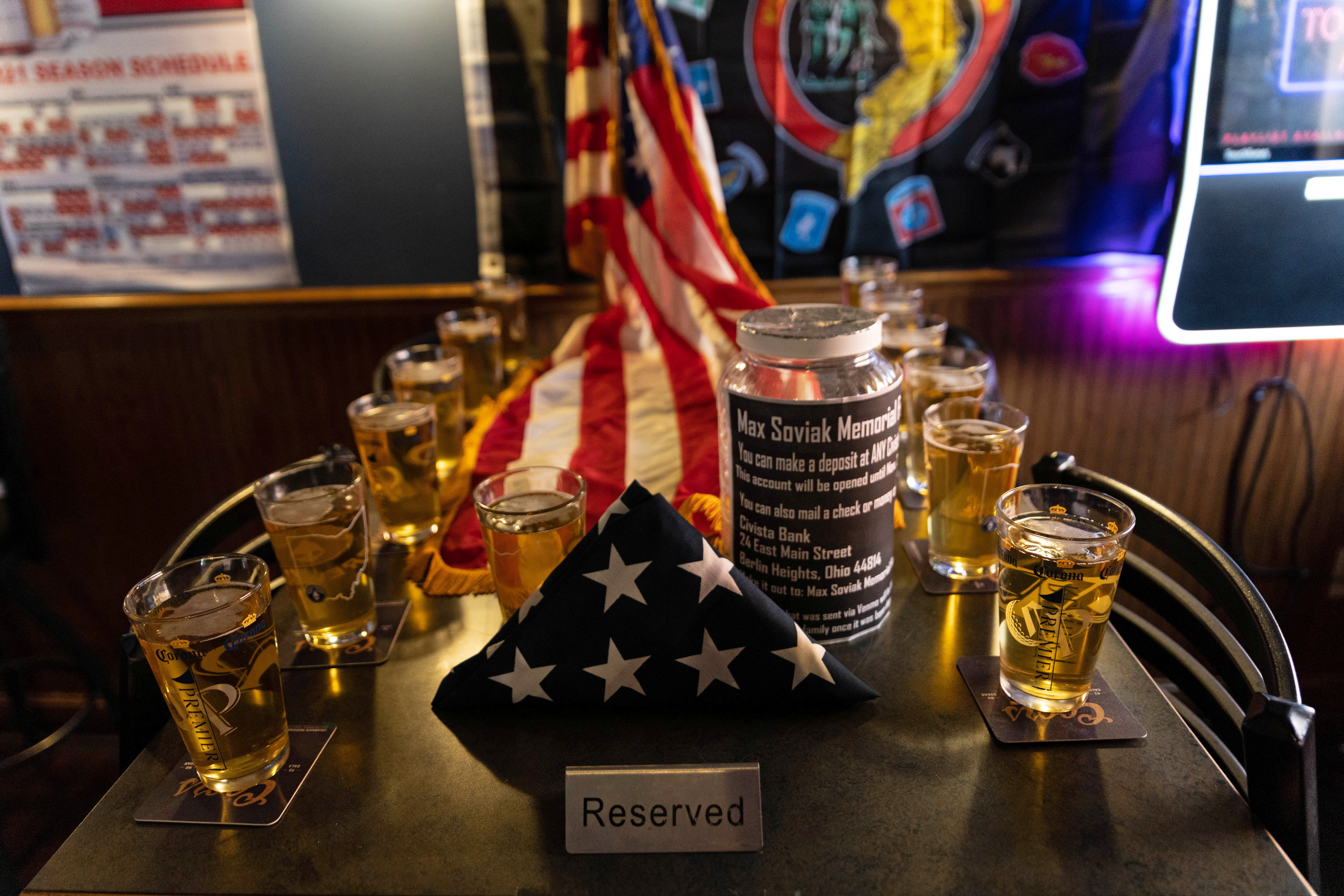 A memorial is set up at a bar for Max Soviak, one of 13 U.S. service members killed in the airport suicide bombing in Afghanistan's capital Kabul, in Berlin Heights, Ohio, U.S., August 29, 2021. REUTERS/Megan Jelinge