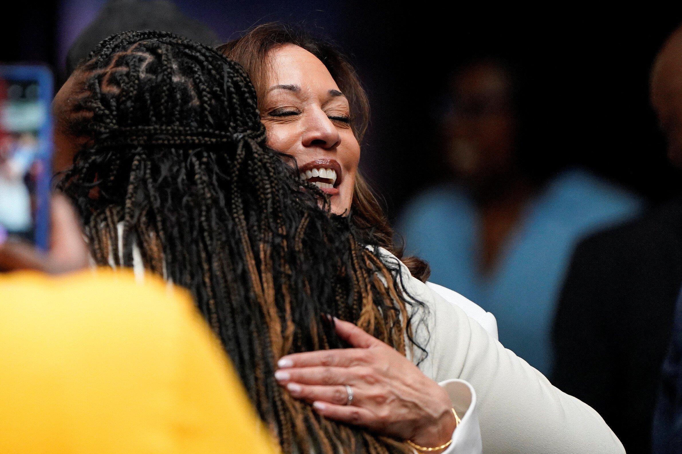 Democratic presidential nominee and U.S. Vice President Kamala Harris hugs, as she attends a volunteer appreciation event at The Grey restaurant in Savannah, Georgia, U.S., August 29, 2024. REUTERS/Elizabeth Frantz