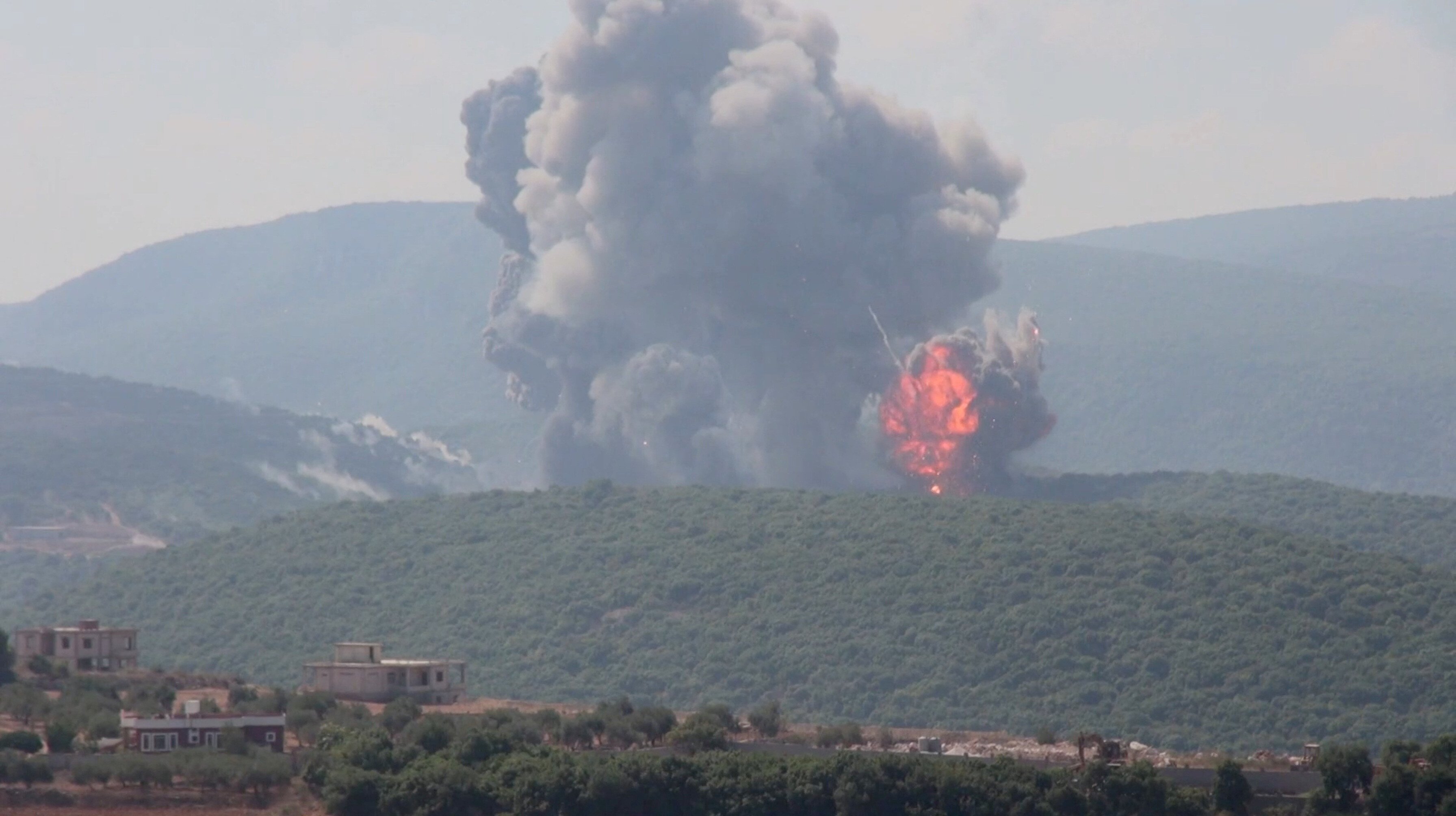 An explosion takes place as Israeli strikes hit southern Lebanon, amid cross-border hostilities between Hezbollah and Israeli forces, as seen from Zibqin, Lebanon, August 25, 2024, in this still image obtained from a video. Reuters TV via REUTERS