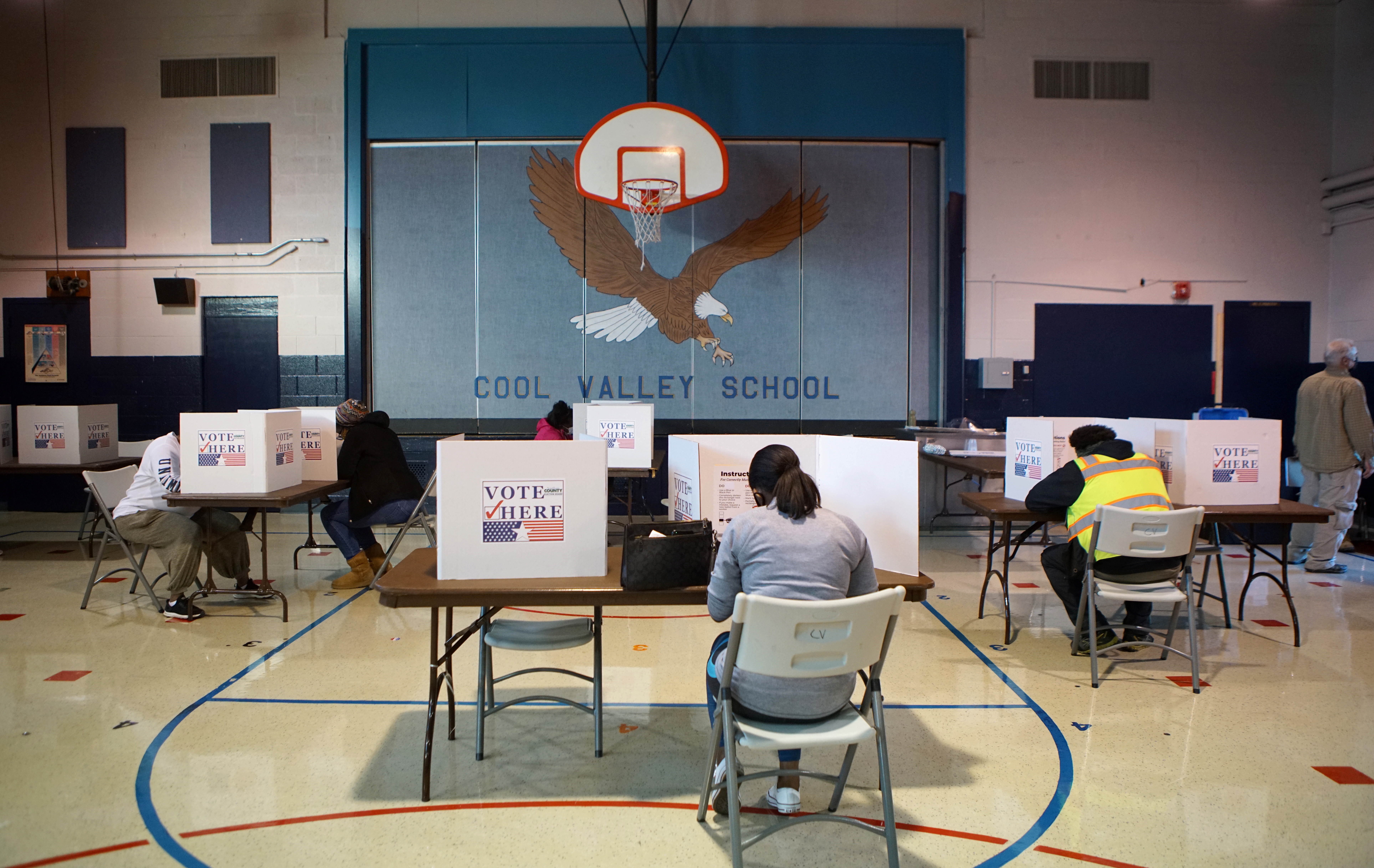 Voters mark their ballots at a Ferguson polling station during Election Day in Missouri, U.S., November 3, 2020. REUTERS/Lawrence Bryant