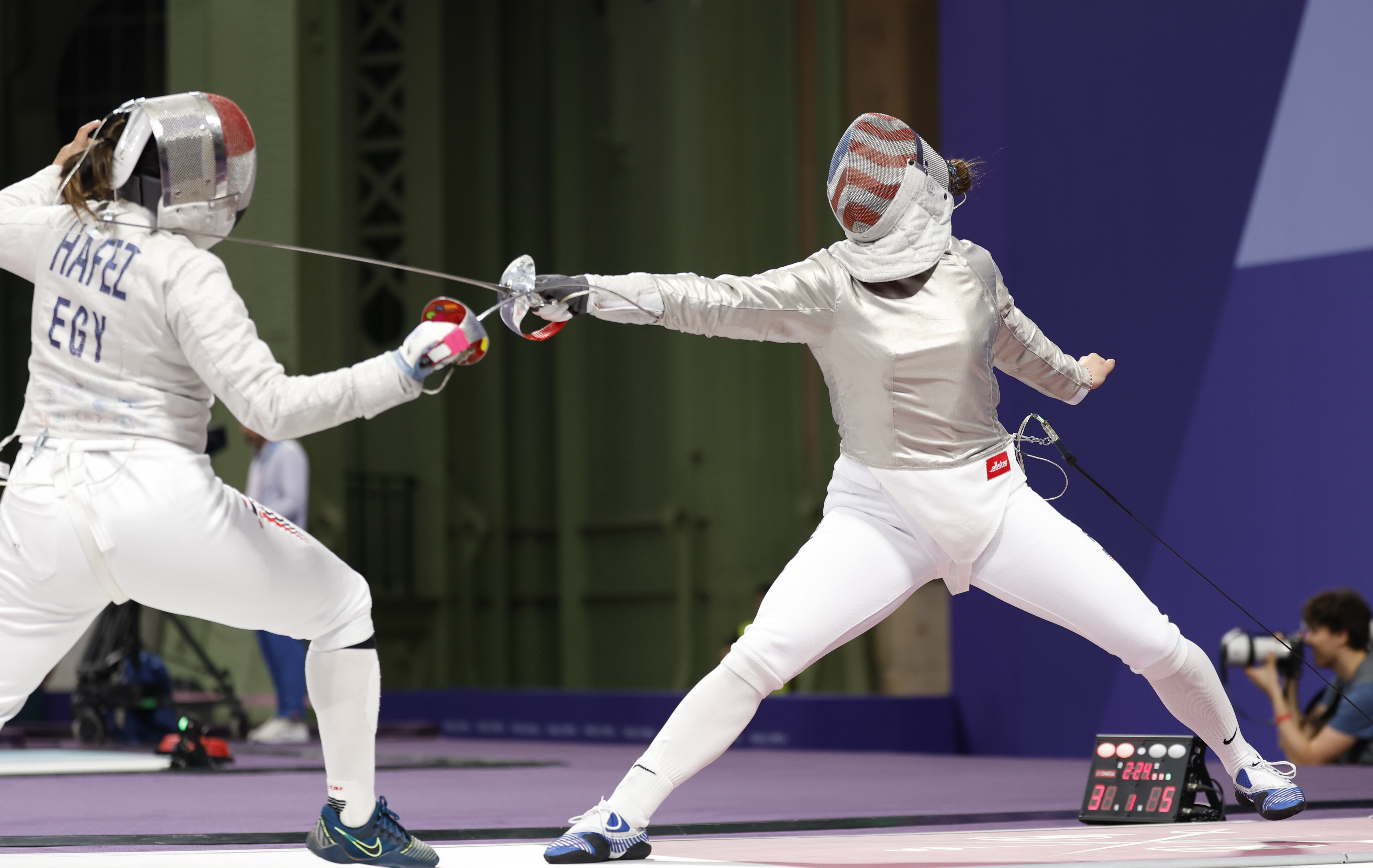 Jul 29, 2024; Paris, France; Elizabeth Tartakovsky (USA) competes against Nada Hafez (EGY) in a women's sabre table of 32 bout during the Paris 2024 Olympic Summer Games at Grand Palais. Credit: Yukihito Taguchi-USA TODAY Sports