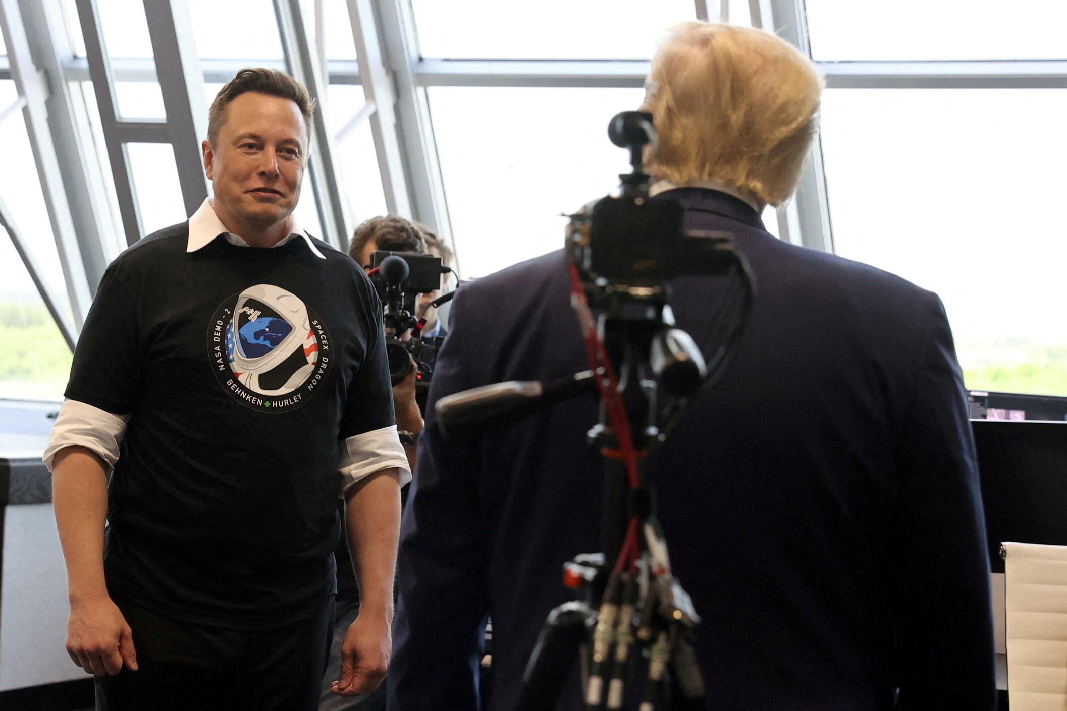 U.S. President Donald Trump and Elon Musk are seen at the Firing Room Four after the launch of a SpaceX Falcon 9 rocket and Crew Dragon spacecraft on NASA's SpaceX Demo-2 mission to the International Space Station from NASA's Kennedy Space Center in Cape Canaveral, Florida, U.S. May 30, 2020. REUTERS/Jonathan Ernst/File Photo