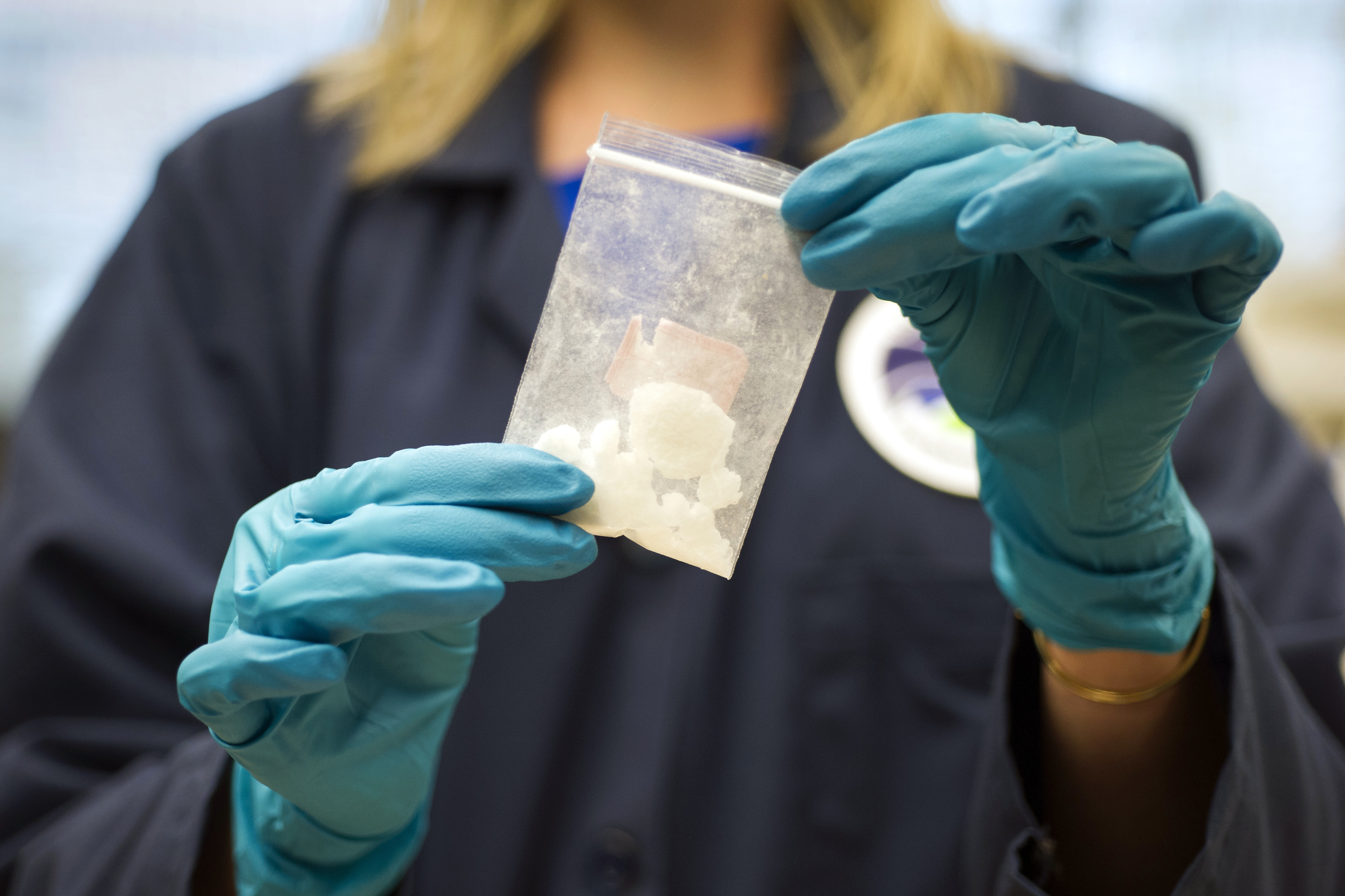 FILE - A bag of 4-fluoro isobutyryl fentanyl which was seized in a drug raid is displayed at the Drug Enforcement Administration (DEA) Special Testing and Research Laboratory in Sterling, Va., on Aug. 9, 2016. China on Friday, July 7, 2023, insisted it is up to the U.S. to “create necessary conditions” for anti-drugs cooperation, following complaints from Washington that Beijing has ignored its calls for a crackdown on precursor chemicals for the highly addictive painkiller fentanyl. (AP Photo/Cliff Owen, File)